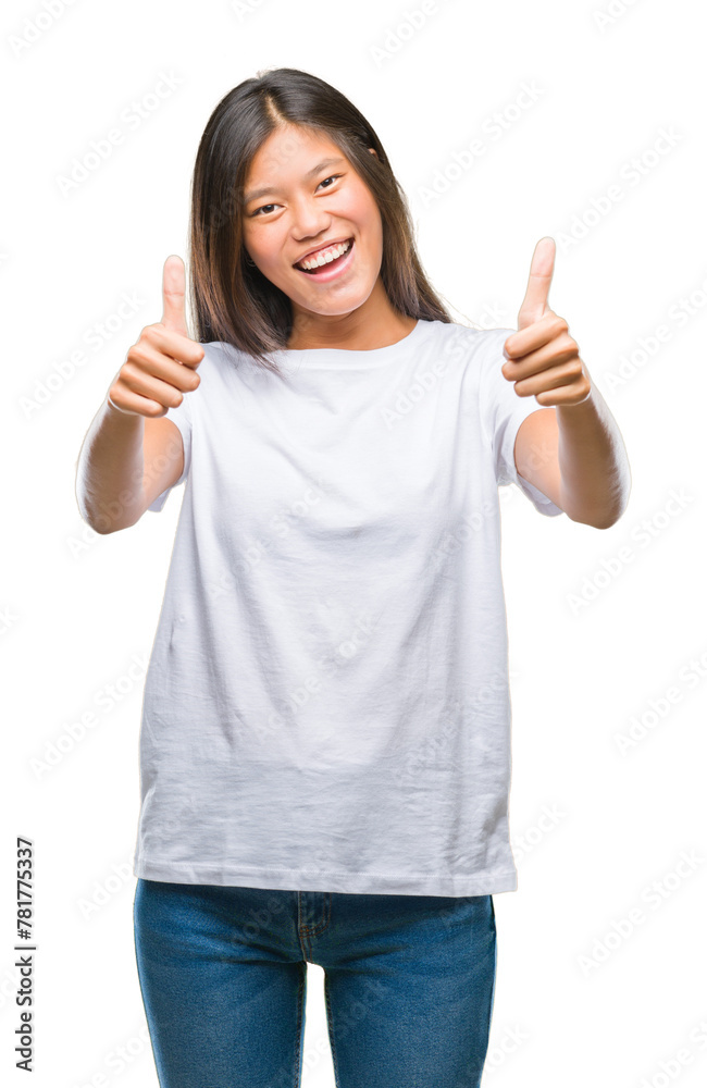 Young asian woman over isolated background approving doing positive gesture with hand, thumbs up smiling and happy for success. Looking at the camera, winner gesture. Young asian woman over isolated background approving doing positive gesture with hand, thumbs up smiling and happy for success. Looking at the camera, winner gesture.