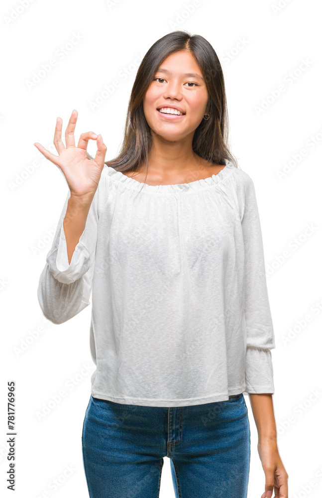 Young asian woman over isolated background smiling positive doing ok sign with hand and fingers. Successful expression. Young asian woman over isolated background smiling positive doing ok sign with hand and fingers. Successful expression.