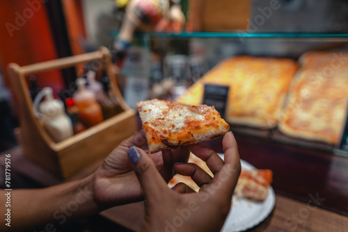 Pizza is sold in front of a shop on Walking Street
