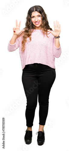 Young beautiful woman wearing pink sweater showing and pointing up with fingers number eight while smiling confident and happy.