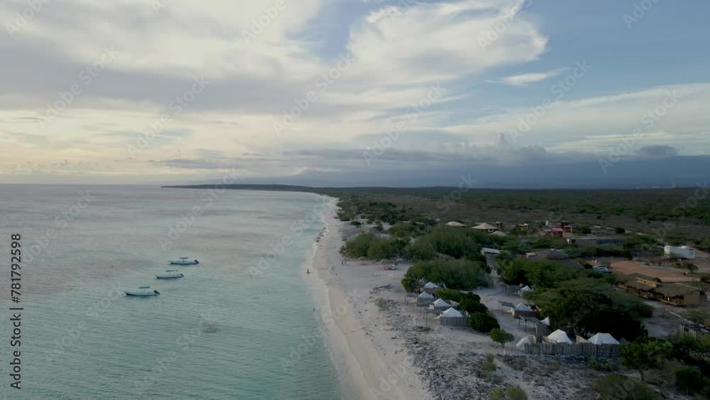 Aerial view of one of the most crystalline beaches in the Dominican Republic, under an incredible sunset sky Aerial view of one of the most crystalline beaches in the Dominican Republic, under an incredible sunset sky