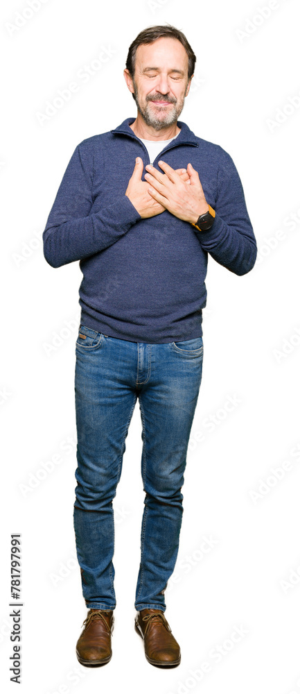 Middle age handsome man wearing a sweater smiling with hands on chest with closed eyes and grateful gesture on face. Health concept. Middle age handsome man wearing a sweater smiling with hands on chest with closed eyes and grateful gesture on face. Health concept.