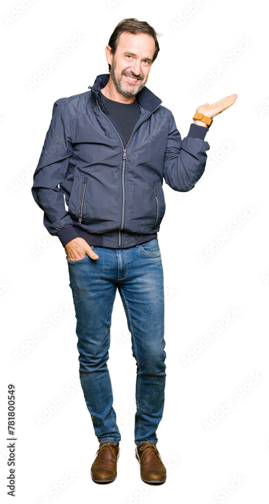 Middle age handsome man wearing a jacket smiling cheerful presenting and pointing with palm of hand looking at the camera. Middle age handsome man wearing a jacket smiling cheerful presenting and pointing with palm of hand looking at the camera.