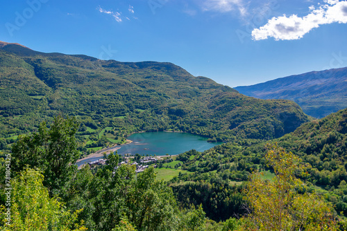 Panoramic view of the Eriste reservoir surrounded by green forests. Benasque Valley. Pyrenees. Huesca. Aragon. Spain photo