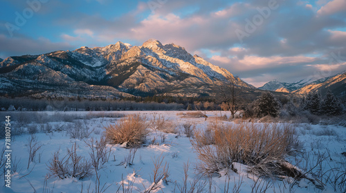 Glorious snow-covered mountains under the vivid colors of sunset, offering a peaceful yet awe-inspiring scene photo