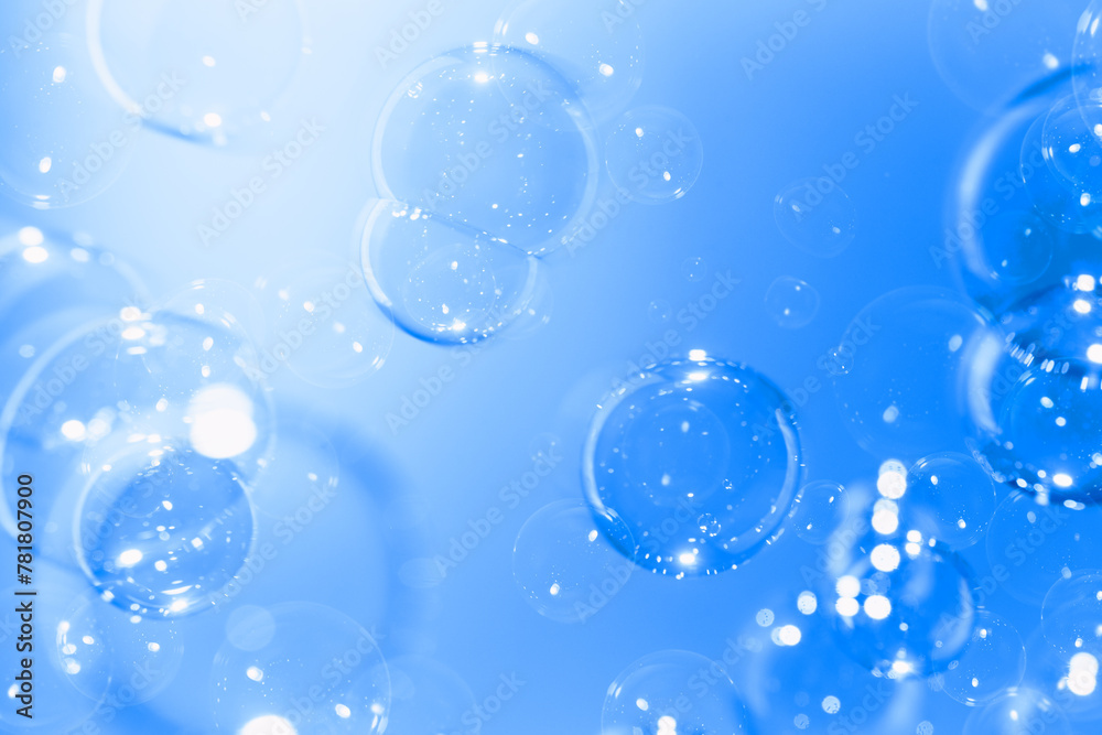 Beautiful Transparent Blue Soap Bubbles Floating in The Air. Celebration Festive Backdrop. Freshness Soap Suds Bubbles Water. Abstract Blue Textured Background.	
