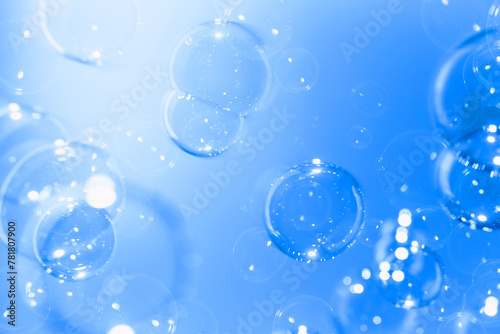 Beautiful Transparent Blue Soap Bubbles Floating in The Air. Celebration Festive Backdrop. Freshness Soap Suds Bubbles Water. Abstract Blue Textured Background. 