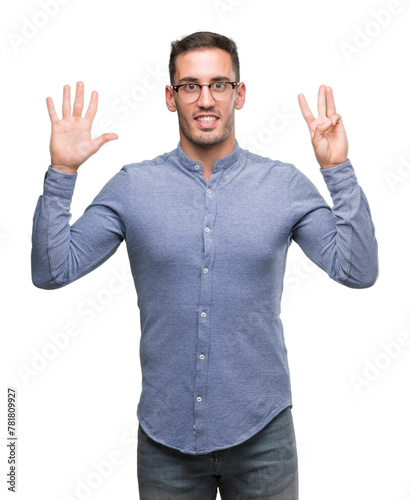 Handsome young elegant man wearing glasses showing and pointing up with fingers number eight while smiling confident and happy.