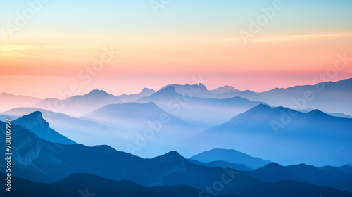 Tranquil scene of layered blue mountain silhouettes complemented by soft gradient colors from sunset to dusk showcasing the calmness of nature © Armin