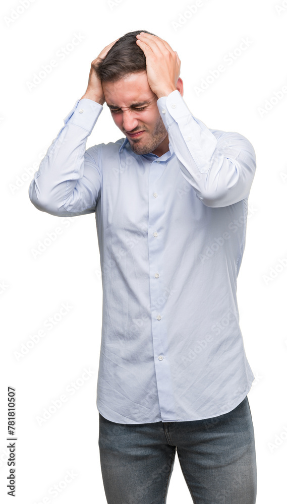 Handsome young businessman suffering from headache desperate and stressed because pain and migraine. Hands on head. Handsome young businessman suffering from headache desperate and stressed because pain and migraine. Hands on head.