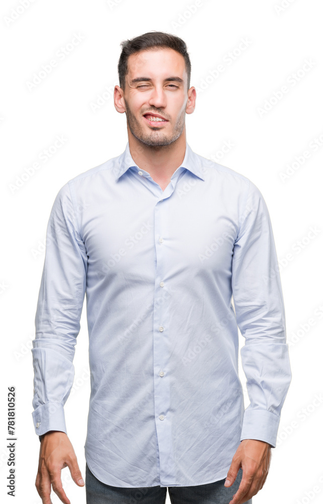 Handsome young businessman winking looking at the camera with sexy expression, cheerful and happy face. Handsome young businessman winking looking at the camera with sexy expression, cheerful and happy face.