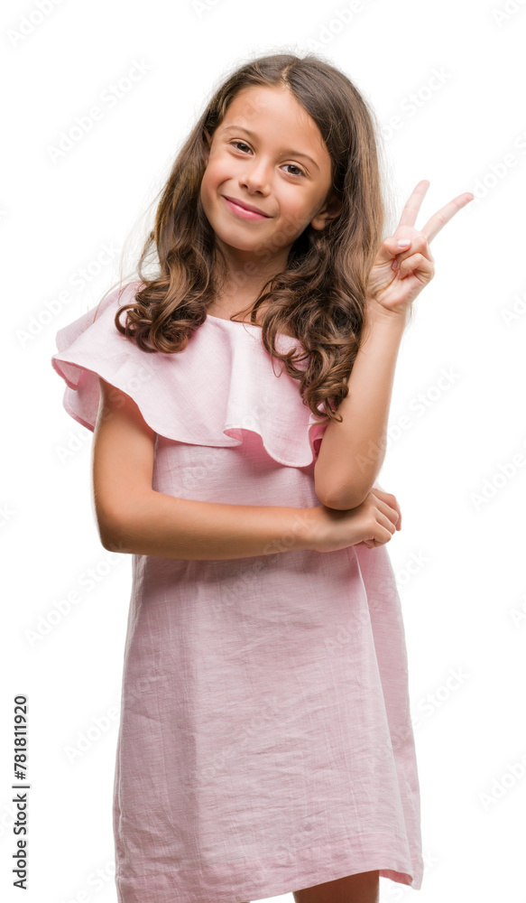 Φωτογραφία Brunette hispanic girl wearing pink dress smiling with happy face winking at the camera doing victory sign
