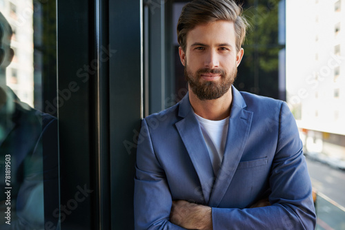 Businessman  portrait and management in modern office for startup  company and development. Male trader  entrepreneur and professional in workplace for trade show  seminar and designer conference.