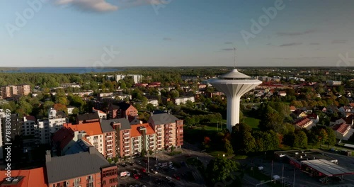 Lake Hjälmaren behind Örebro landmark water tower Svampen, cityscape aerial photo