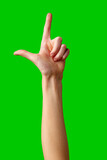 Human Hand Gesture Representing the Letter L Against a Green Background