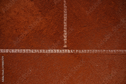 Horizontal tennis service line on red clay court