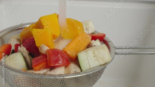 The video shows vegetables being washed under water, demonstrating the process of preparing fresh produce. Perfect for culinary recipe videos and advertising healthy eating.
