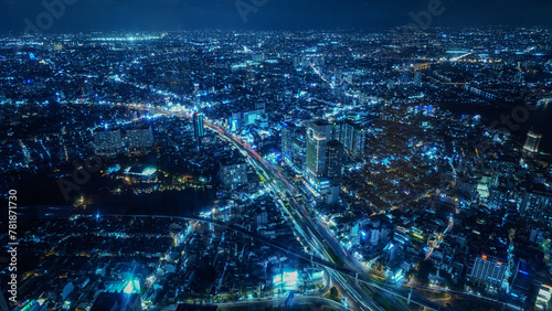 view of the Saigon Ho Chi Minh city at night, blue color traffic road lights and urban connection