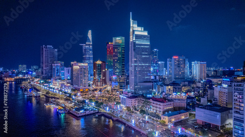 Aerial night illuminated Saigon city skyline skyscrapers view and busy traffic on the main road of Ho Chi Minh © Sky Canvas