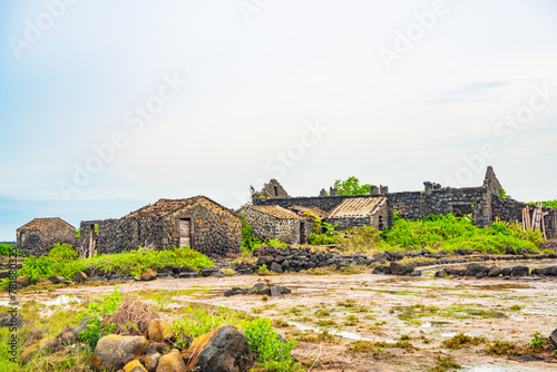 Stone houses and stone piles in the ancient salt fields of Yanding, Danzhou, Hainan, China photo