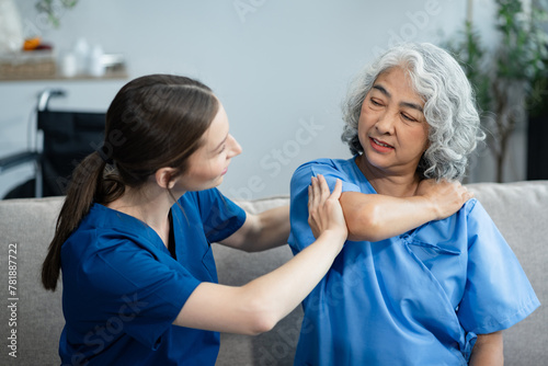 Wallpaper Mural senior woman doing exercise at clinic with physiotherapist. help of a personal trainer during a rehabilitation session. Torontodigital.ca