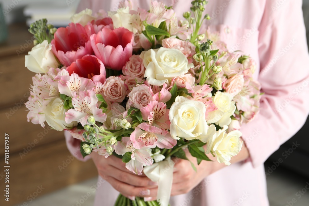 Woman with beautiful bouquet of fresh flowers indoors, closeup Woman with beautiful bouquet of fresh flowers indoors, closeup