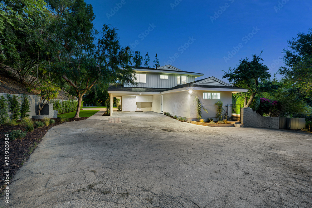 Remodeled Los Angeles home with a vacant concrete driveway Remodeled Los Angeles home with a vacant concrete driveway