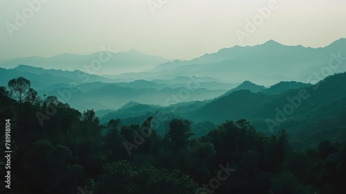 Serene Dawn Mist Over Layered Mountain Range © evening_tao