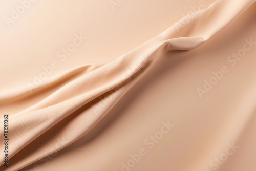 The image shows a close-up of smooth satin fabric creating a luxurious and sophisticated texture in soft neutral tones