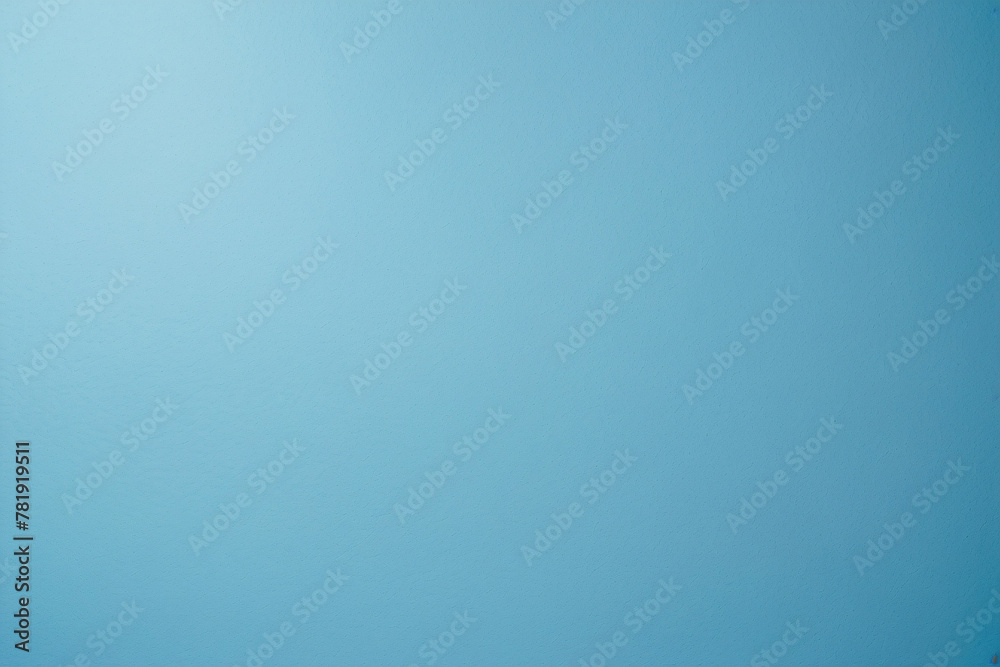 Soft shadow cast on a blue textured paper provides a cool and calm visual suitable for various creative uses Soft shadow cast on a blue textured paper provides a cool and calm visual suitable for various creative uses