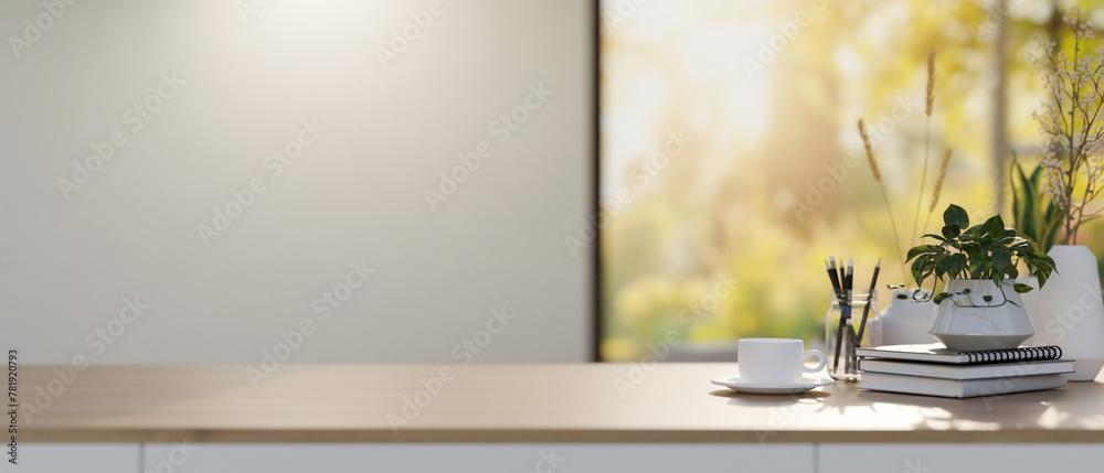 A wooden tabletop with decor and space for display products against the white wall and window. - obrazy, fototapety, plakaty 