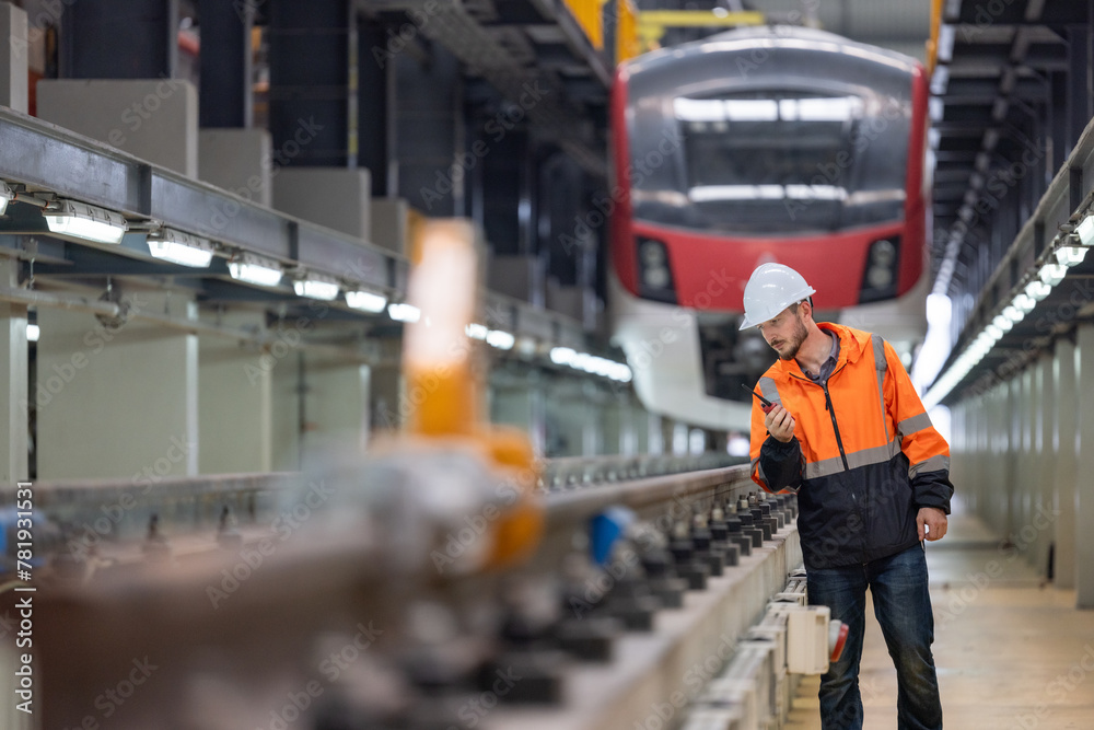 Obraz premium Rail engineer check and optimize overall infrastructure for energy efficient, green operations.