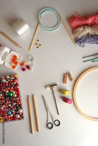 Various craft supplies on white background. Supplies for jewelry making, drawing and needlework. Flat lay.