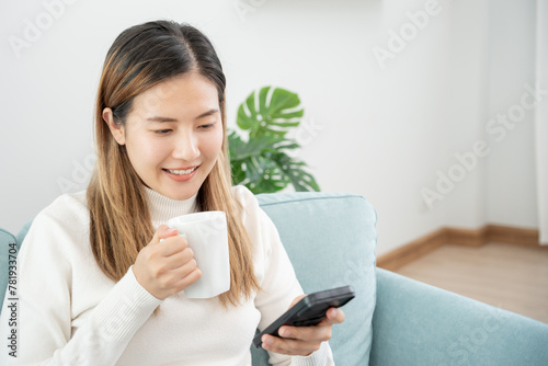 woman using smartphone for online shopping at home. stay home, technology, electronic commerce, internet, market place, final or summer or big sale, payment, discount for credit, offer, Low price photo