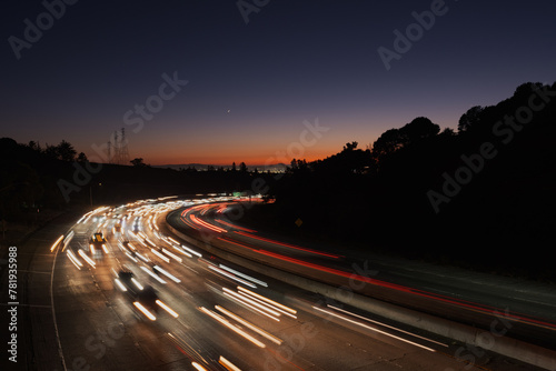 Countless cars stream along Highway 24 in Oakland at sunset, heading inland from San Francisco and the rest of the Bay Area.