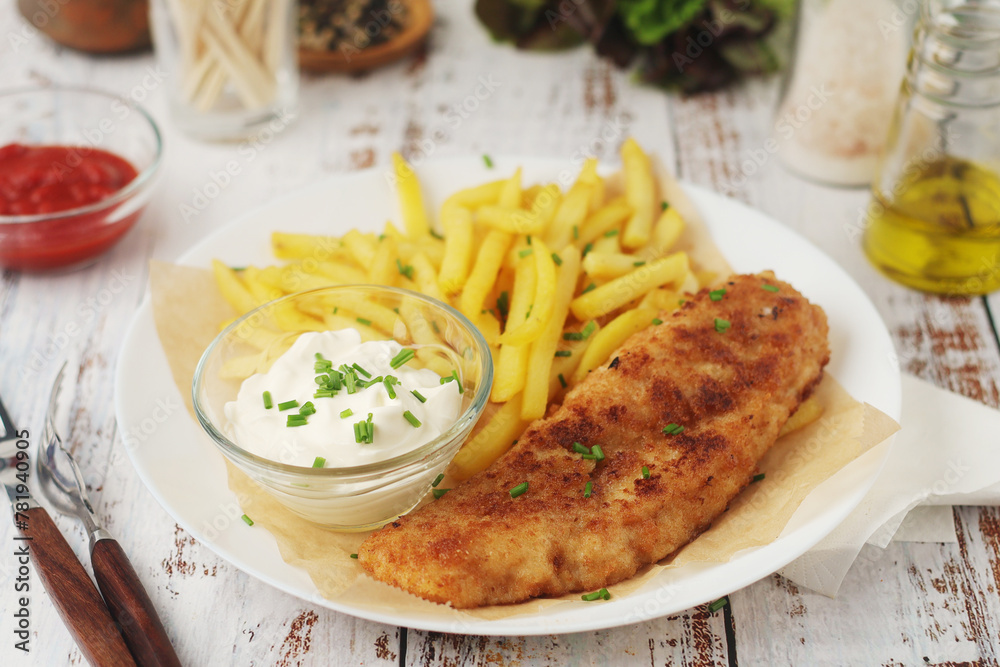 Fish and chips served on the plate, traditional dish of Great Britain Fish and chips served on the plate, traditional dish of Great Britain
