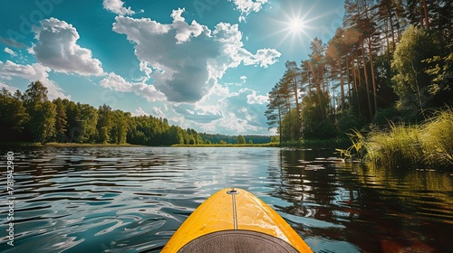 Kayaking and sup boarding on a forest lake in summer. Balance and equilibrium, active recreation in summer in nature