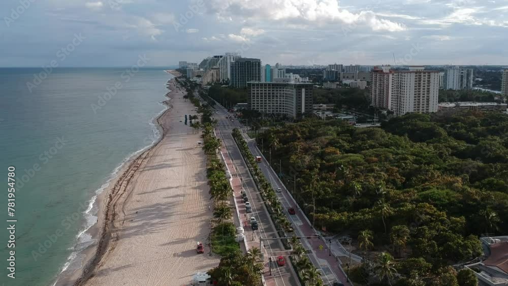 Aerial view of avenue traffic, skyscrapers, and palm trees on Sunny Isles Beach, Miami, USA Aerial view of avenue traffic, skyscrapers, and palm trees on Sunny Isles Beach, Miami, USA