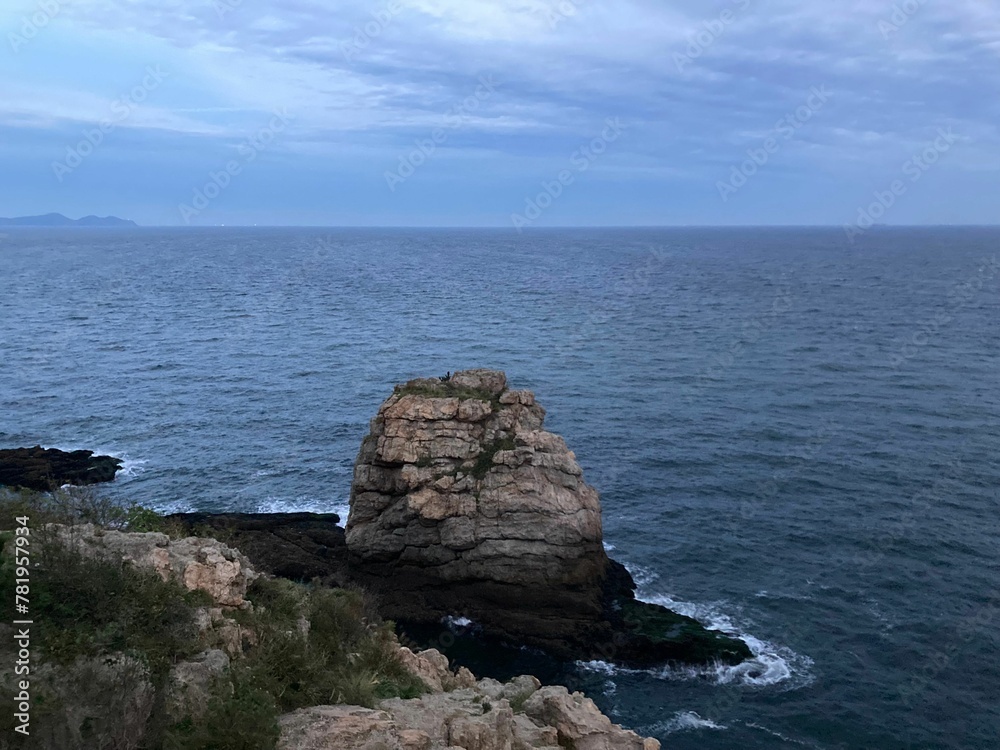 Scenic view of a coastal rock found on Bangchui island with a beautiful seascape on the horizon