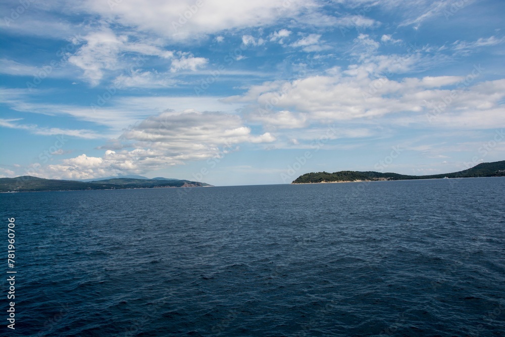 Beautiful shot of the blue sea during cruise from Amaliapoli to Skiathos islands in Greece