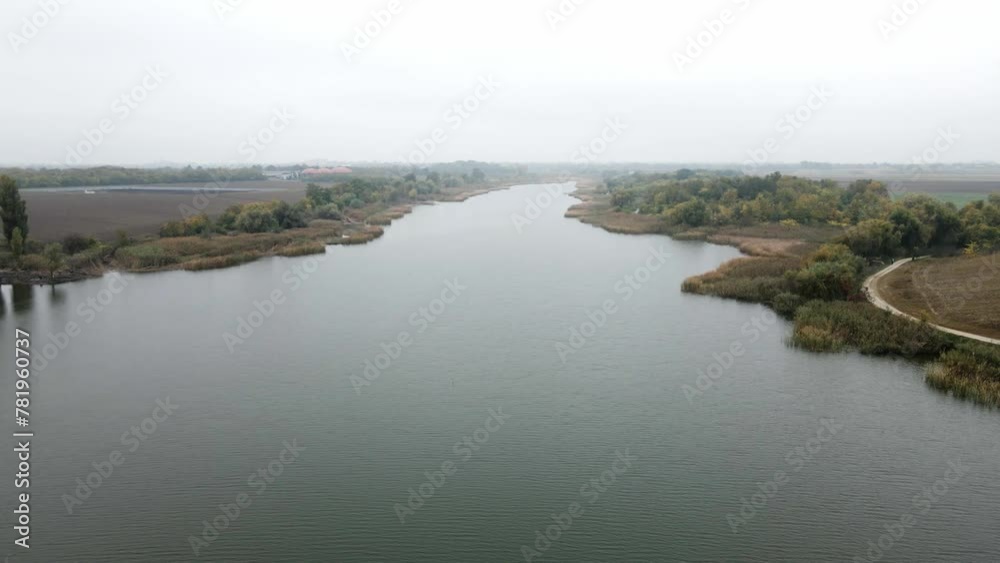 Aerial view of trees and fields surrounding lake Krivaja in foggy autumn day Aerial view of trees and fields surrounding lake Krivaja in foggy autumn day
