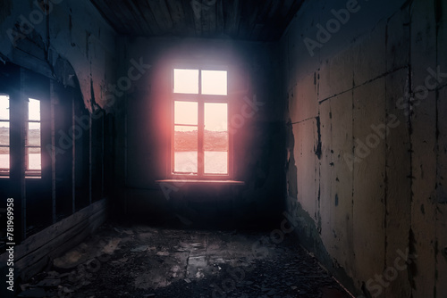 The seaside house has long been abandoned. Window overlooks to sea of Arctic Ocean photo