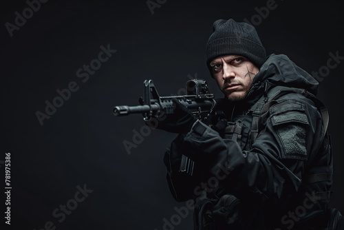 caucasian man, special forces soldier, armed man in black gear holding an assault rifle