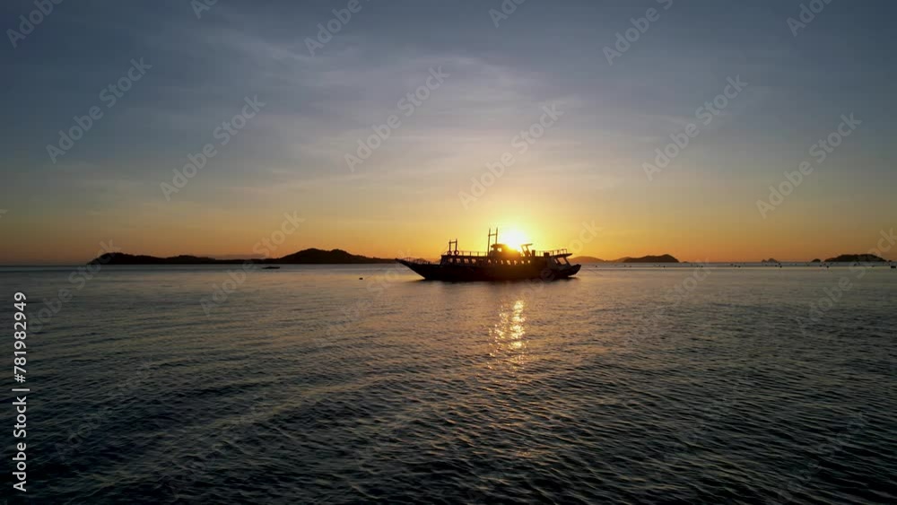 Traditional philippine boat bangka at sunset time in Linapacan, Philippines. Orange sky sunset paradise beach. Traditional philippine boat bangka at sunset time in Linapacan, Philippines. Orange sky sunset paradise beach.