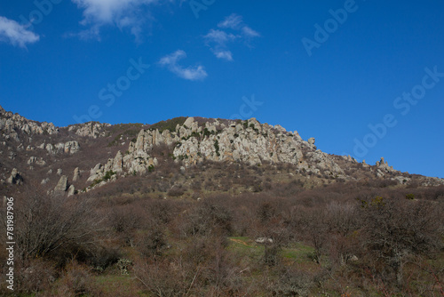 Mountains in spring Crimea against a background of blue sky and bright sunlight