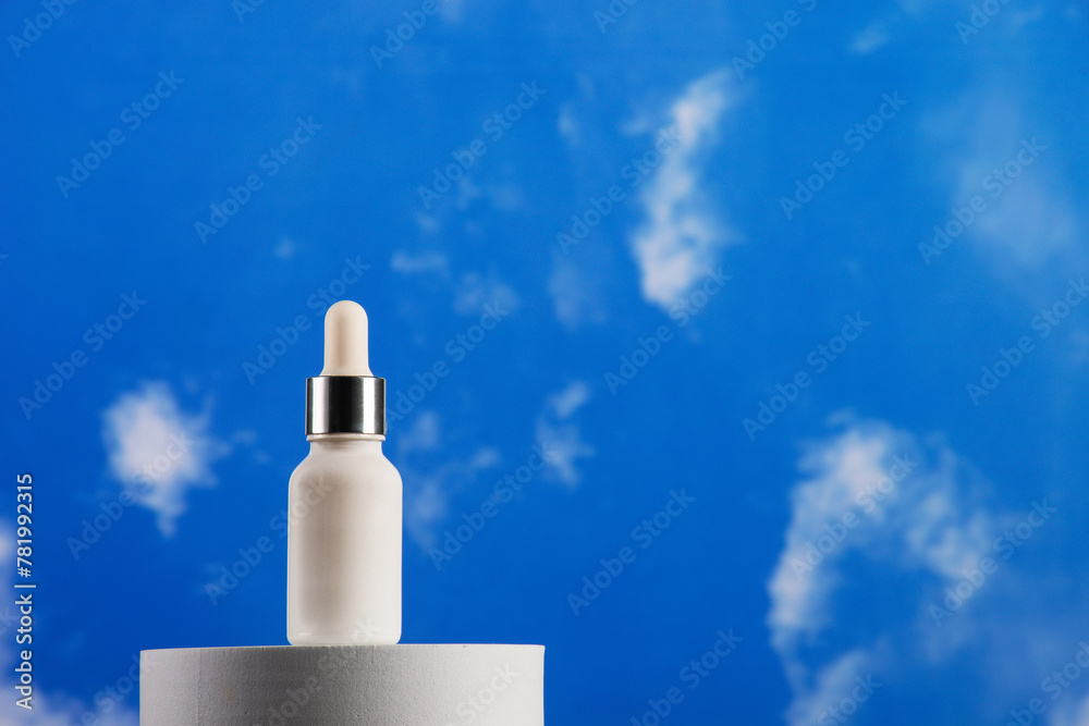 Plastic white tube for cream or lotion. Skin care or sunscreen cosmetic with stylish props on sky background. Plastic white tube for cream or lotion. Skin care or sunscreen cosmetic with stylish props on sky background.