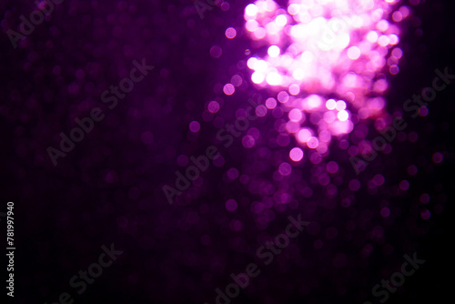 Abstract purple bokeh glitter lights defocused