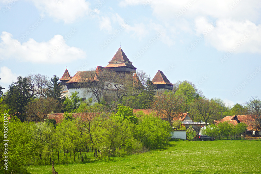 View of the fortified church in the village of Viscri - a landmark of Romania, listed as a UNESCO World Heritage Site