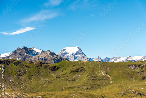 at the peak of mountain with the view of the alps  in Glarus Switzerland