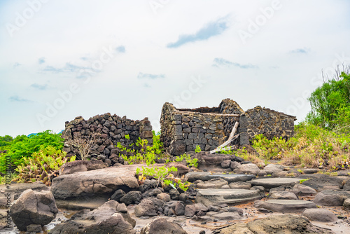 Stone houses and stone piles in the ancient salt fields of Yanding, Danzhou, Hainan, China photo